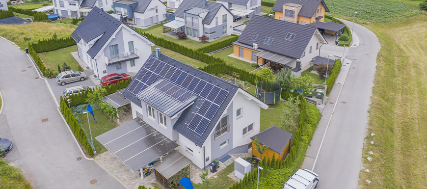 Birds eye view of homes with solar panels